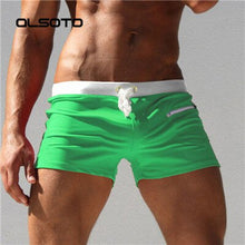 Load image into Gallery viewer, White Trimmed Solid Color Swim shorts
